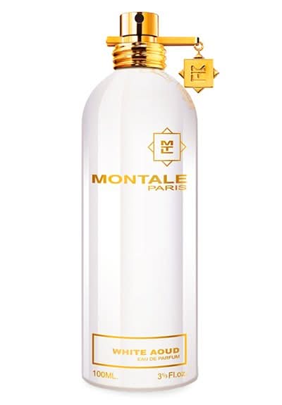 Montale white aoud eau de parfum bottle, white glass with gold cap and label