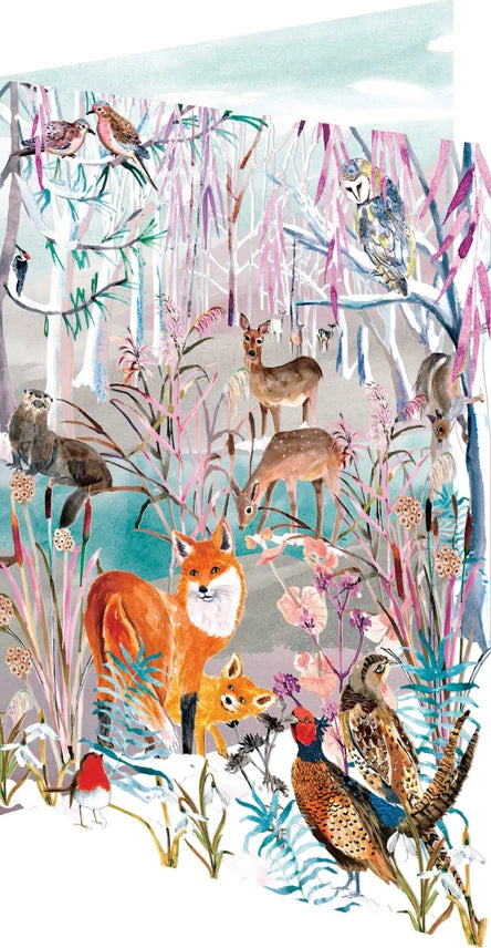 Close-up laser-cut Christmas card with orange foxes and small forest animals