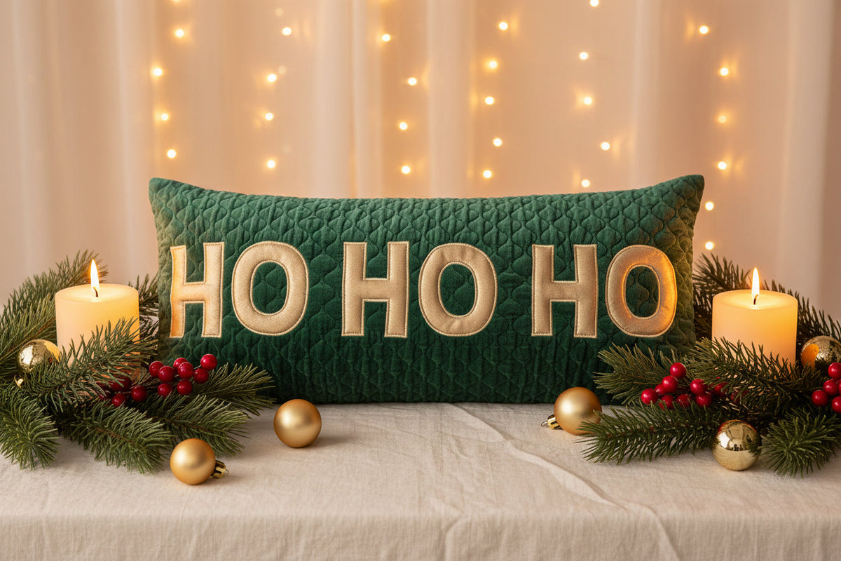 Green quilted velvet lumbar pillow with gold "HO HO HO" lettering