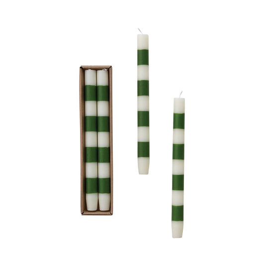 Boxed set of green-and-white striped taper candles with unlit wicks