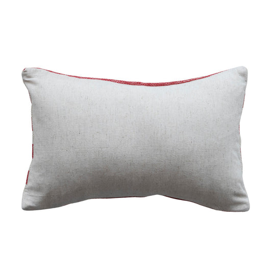 Cream lumbar pillow with red piping and stitched edges