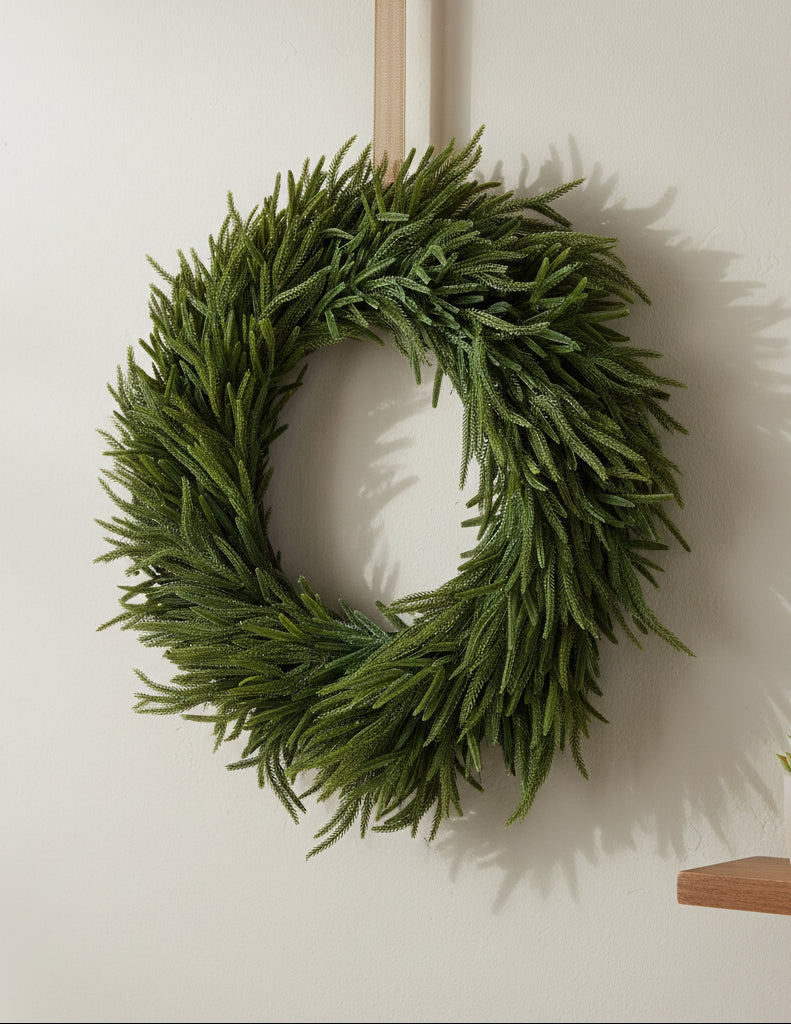 Norfolk pine wreath with dense green needles in a circular shape