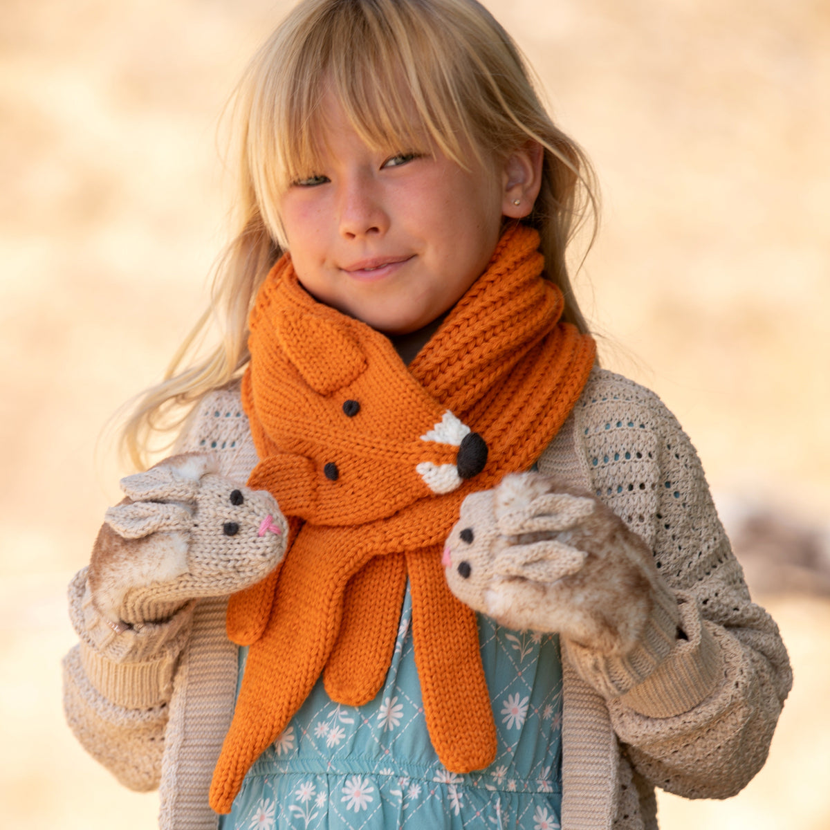 Baby knotted beanie hat in white with chicken print, gray and orange details