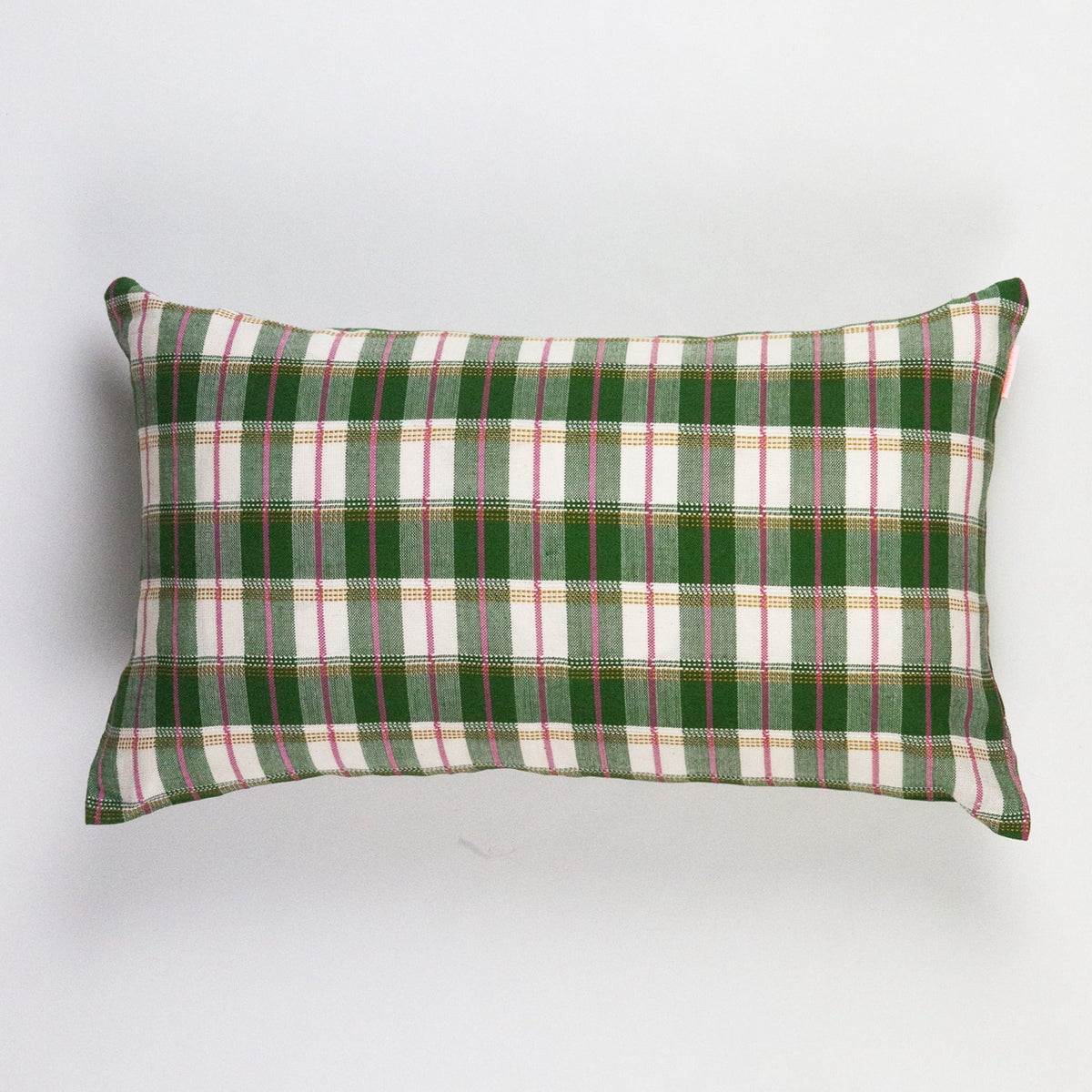 Green gingham lumbar throw pillow with piped border and straight knife-edge seams
