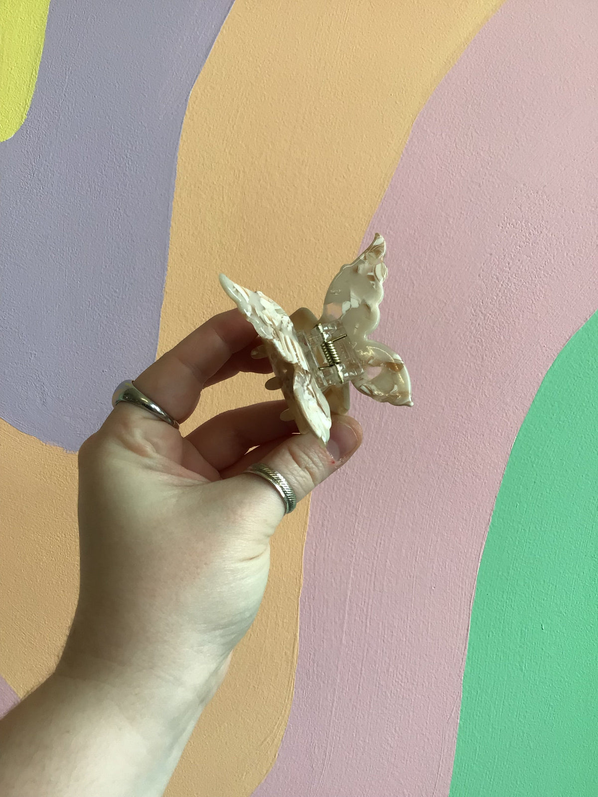 Butterfly hair claw with pale silver iridescent wings and metal hinged clip