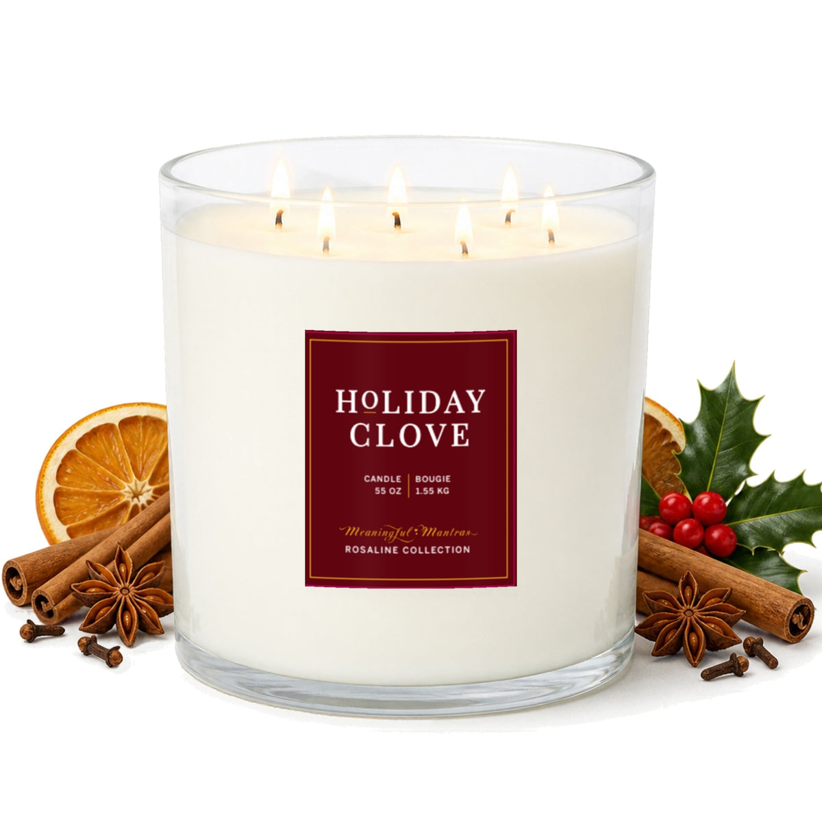 Holiday Clove candle in a clear glass jar with multiple lit wicks