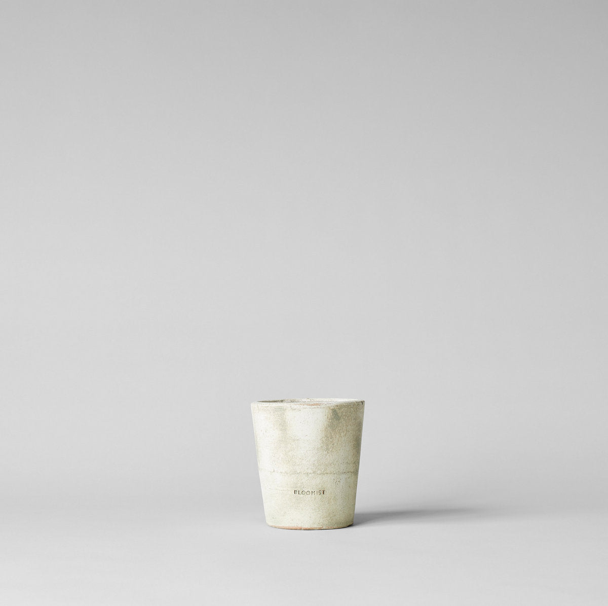 White patina terracotta planter with worn texture, no tray