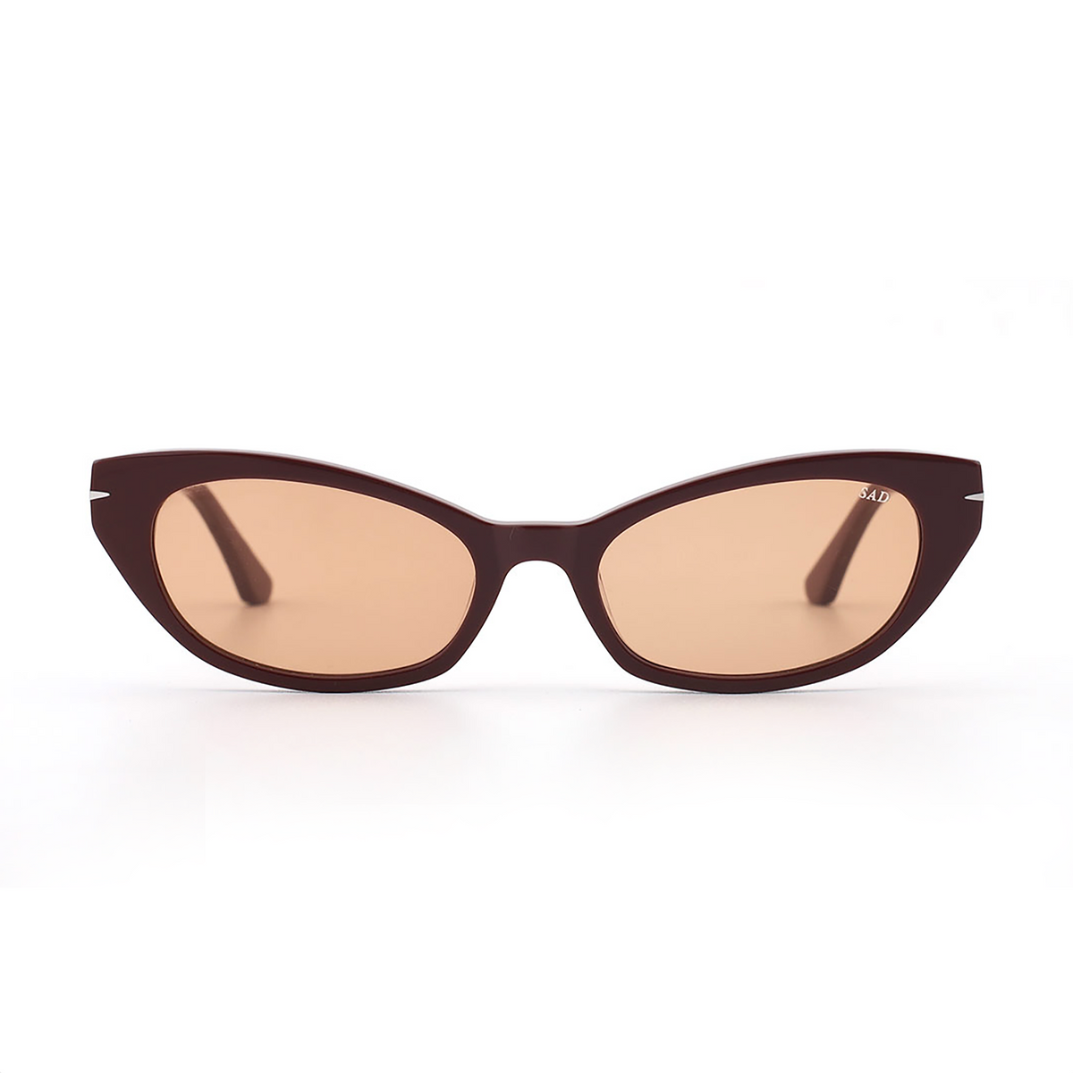 Burgundy cat-eye sunglasses with amber tinted lenses and dark double-bridge frame