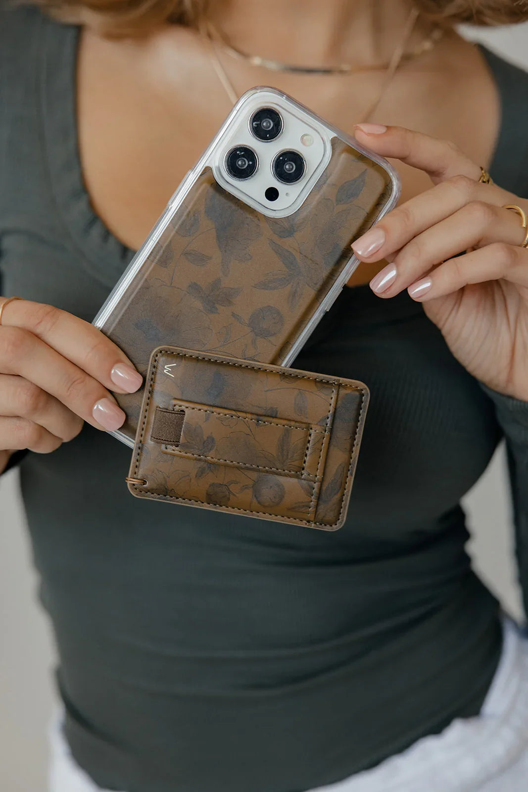 Brown patterned magnetic wallet phone case with card slots and clear cover on phone