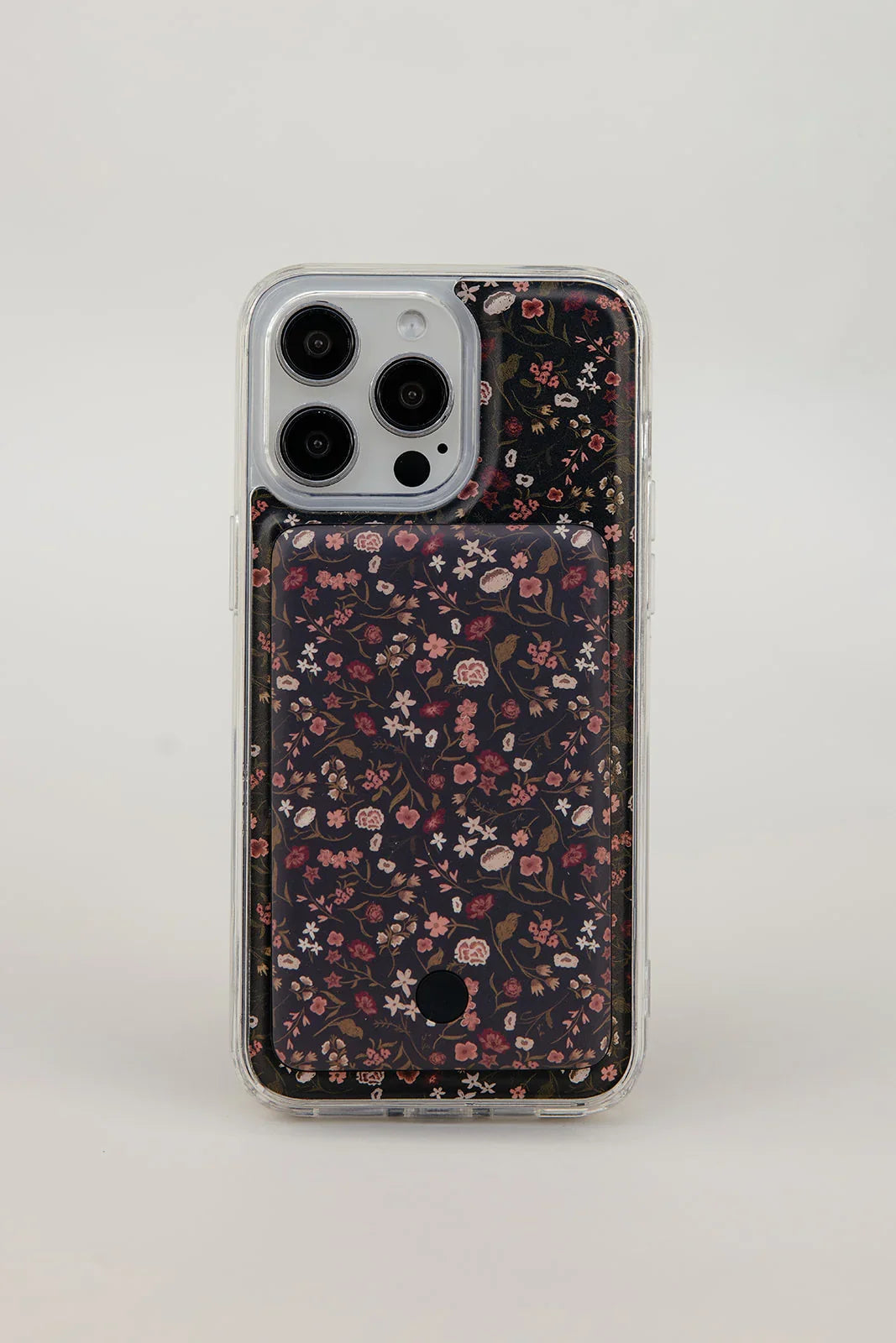 Clear-edged phone case with dark floral pattern and camera lens openings