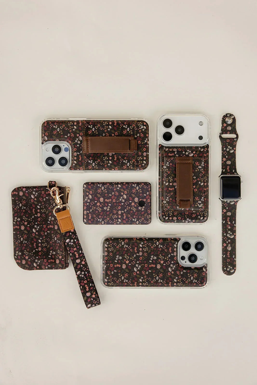 Matching floral accessories with zip pouches and strap, laid flat.
