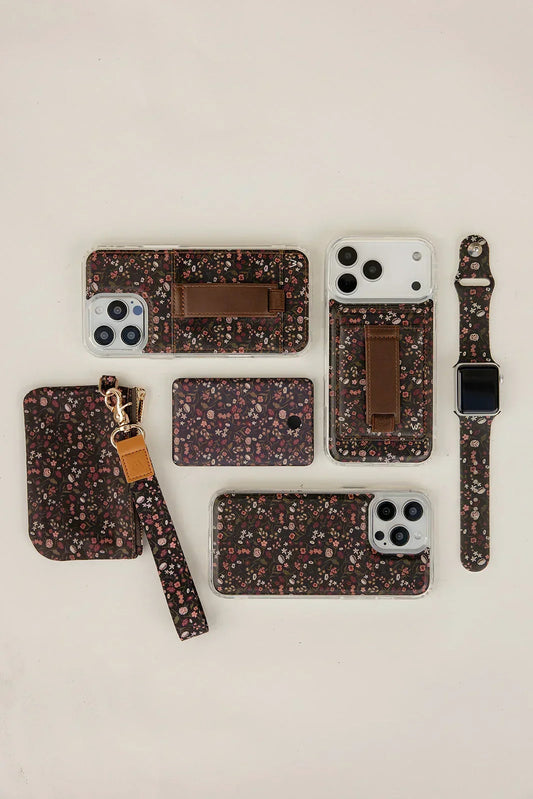 Black floral watch band with square smartwatch case, laid flat