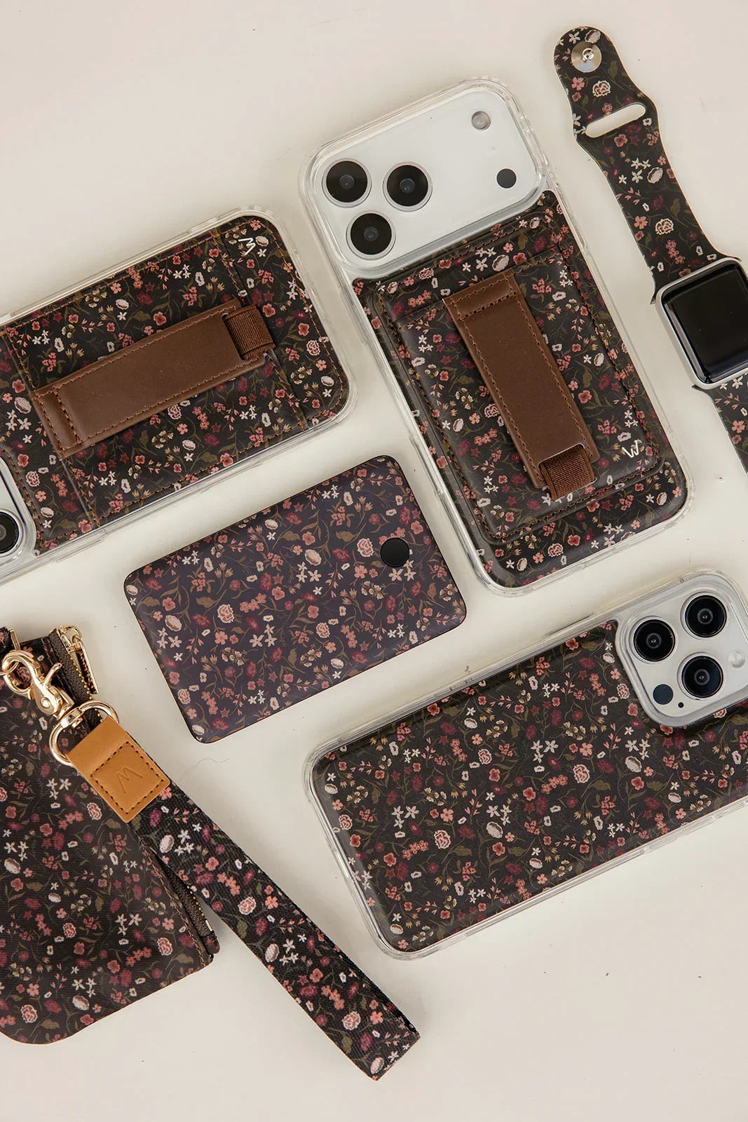 Set of magnetic iPhone cases with clear shells and dark floral fabric