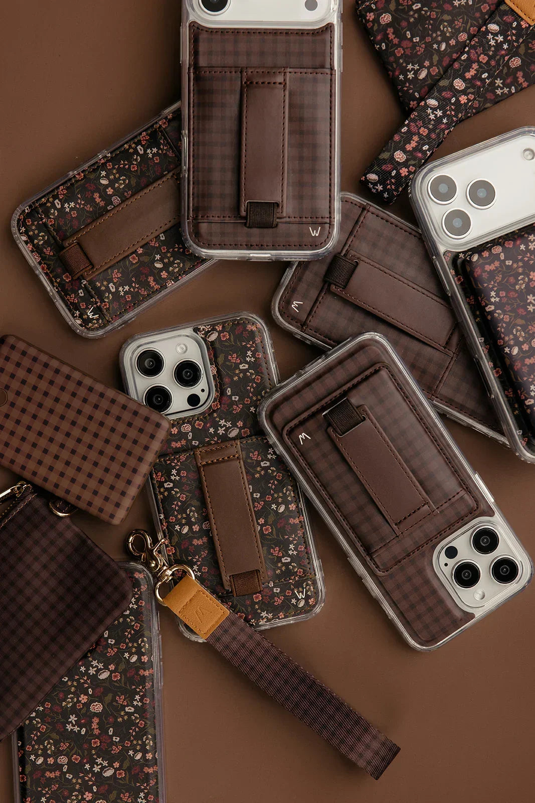Assorted floral phone cases with brown strap wallets and clear covers