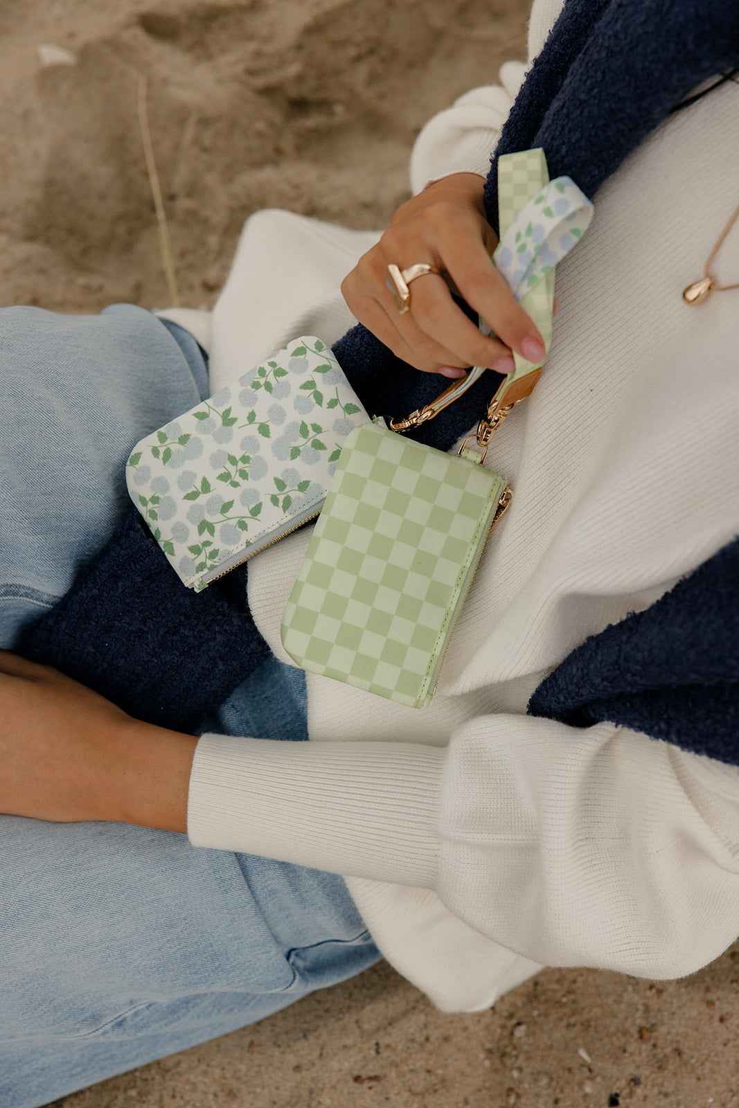 Leaf wrist lanyard being used with a small phone accessory pouch