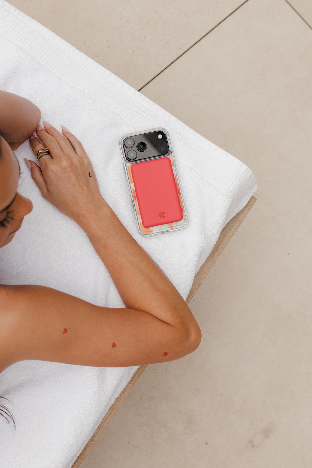 Clear magnetic phone case with watercolor waves and solid red backing panel