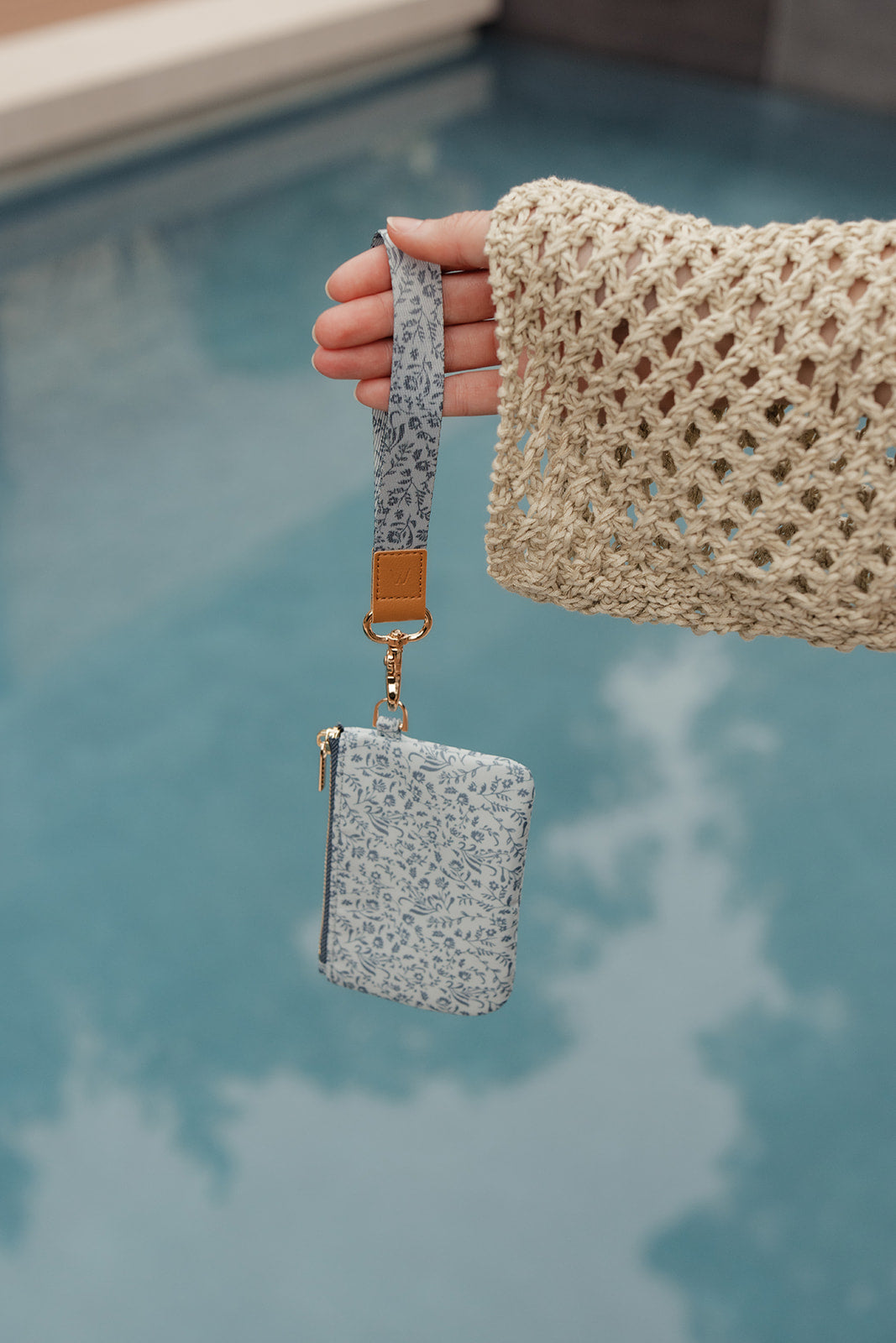 Blue patterned wrist lanyard with card holder and gold clasp