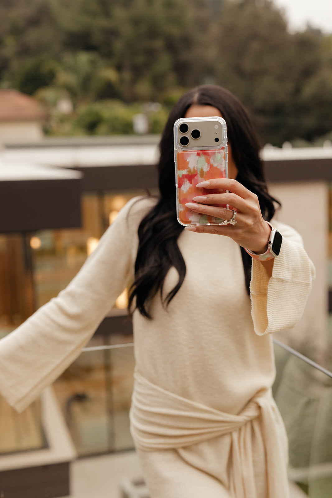 Magnetic phone case with orange-pink watercolor waves design and camera openings