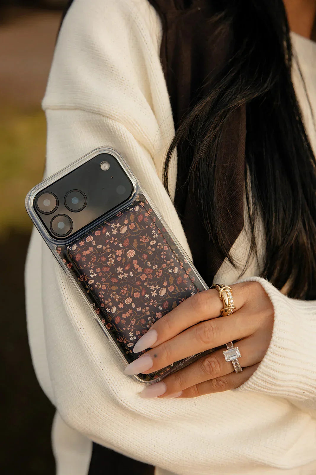 Close-up of floral phone case with clear frame around camera