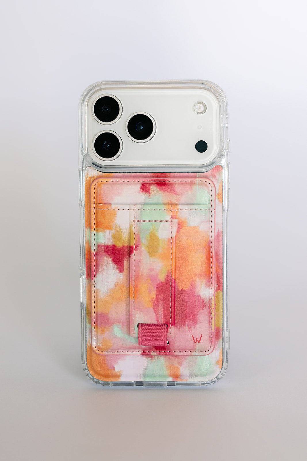 Clear phone case featuring a watercolor magnetic wallet pocket with orange strap