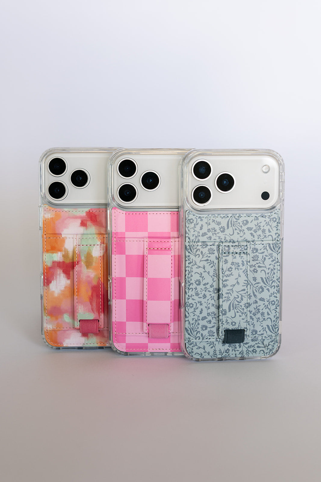 Set of watercolor phone cases with card pockets and wrist straps, three designs