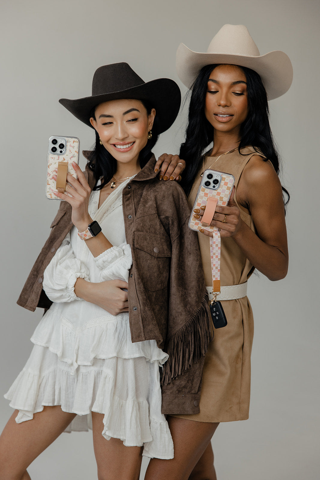 Orange-pink checker phone case held by two people
