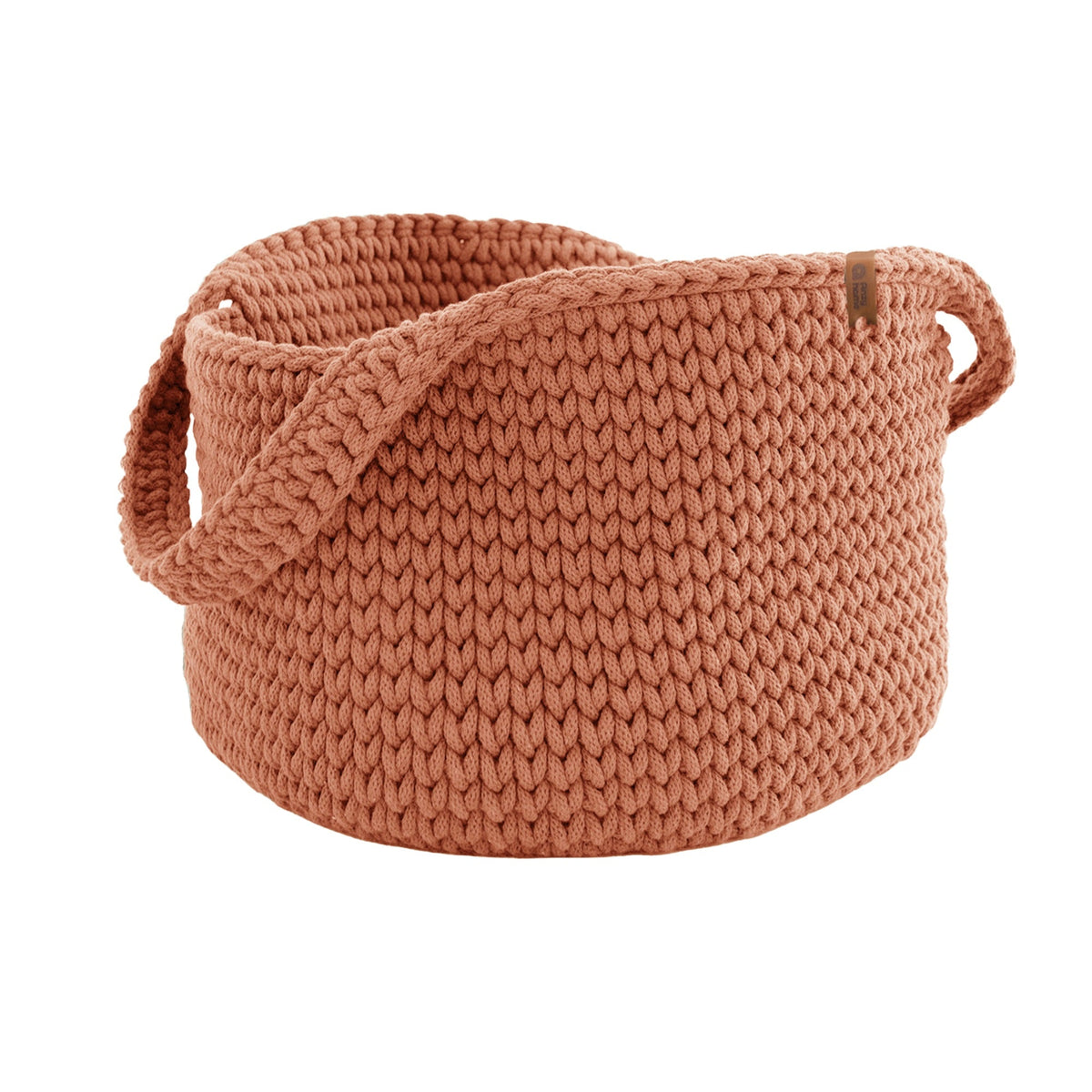 Terracotta round knit basket with side handles, textured fabric and rolled edge.
