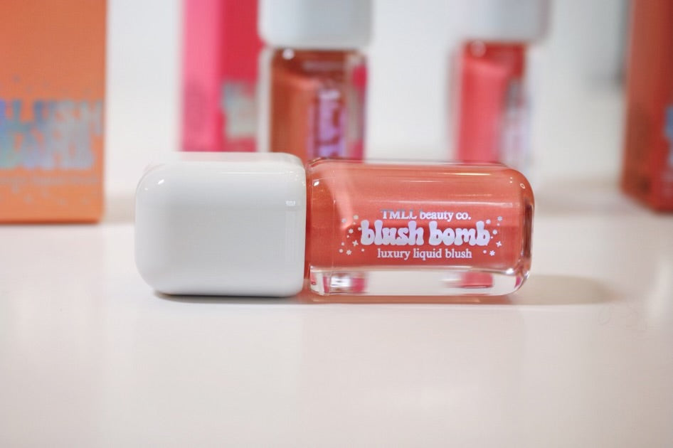 Single liquid blush bottle with white cap and peach-pink liquid.