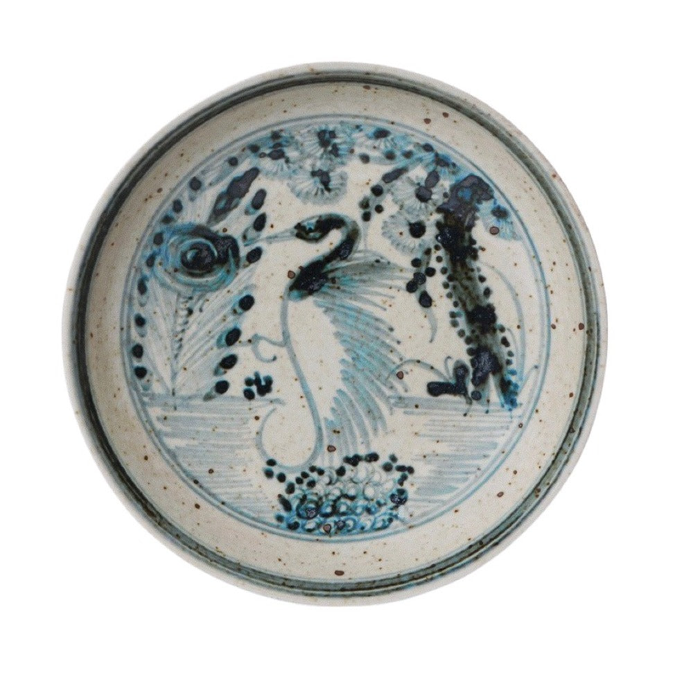 Small porcelain dish with blue-and-white crane and floral pattern
