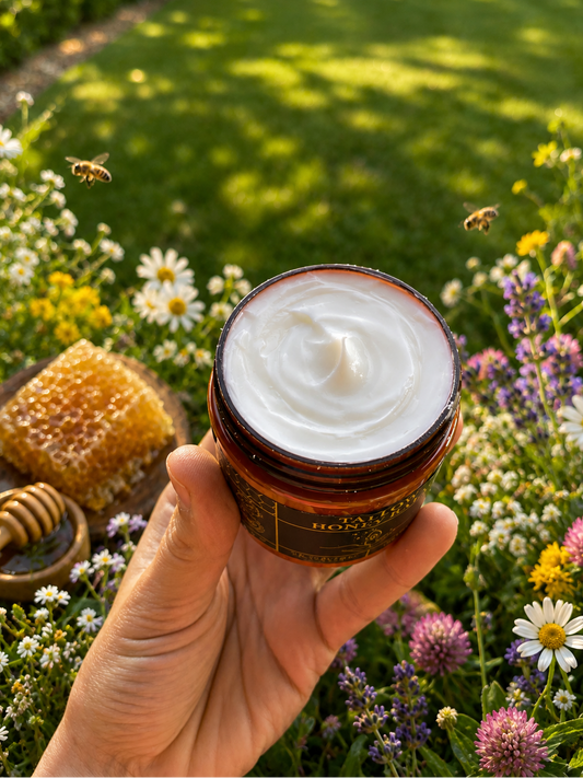 Tallow honey balm jar with smooth white cream, held in a hand