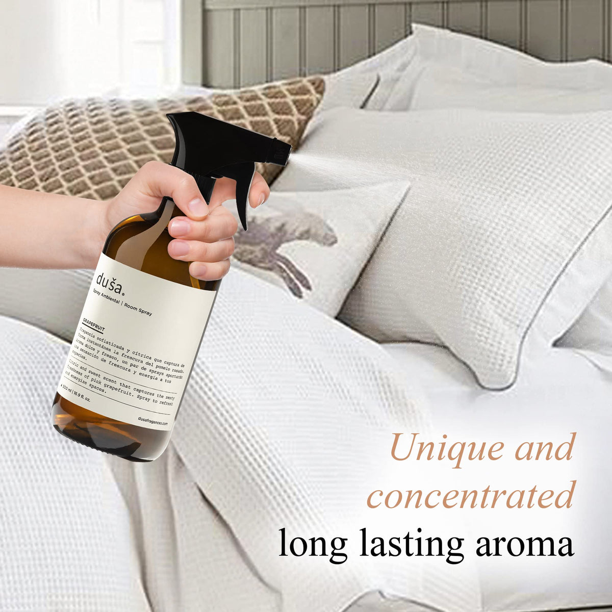 Grapefruit room and linen spray bottle held over white bedding