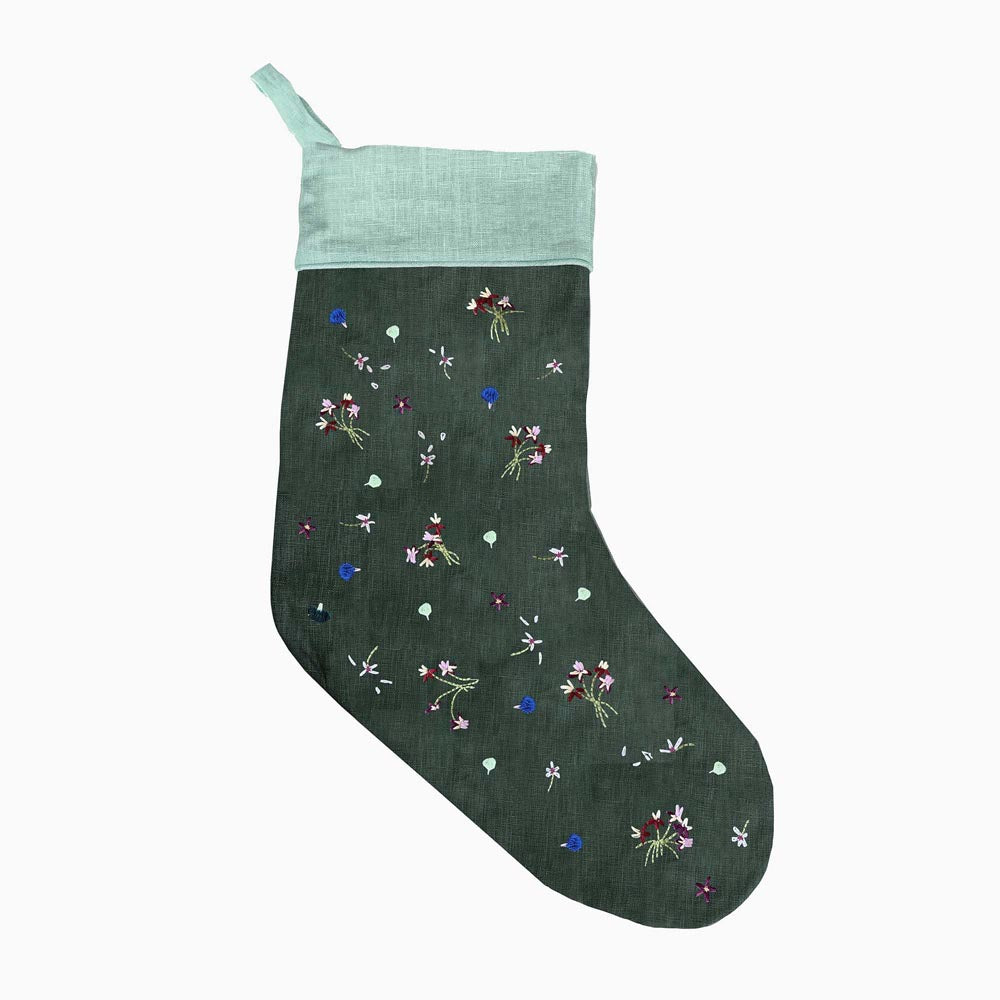 Green holiday stocking with light aqua cuff and colorful mushroom garden embroidery