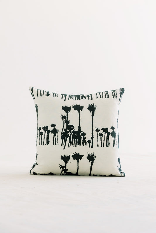 Bosque 18x18 throw pillow with black animal silhouettes on white fabric