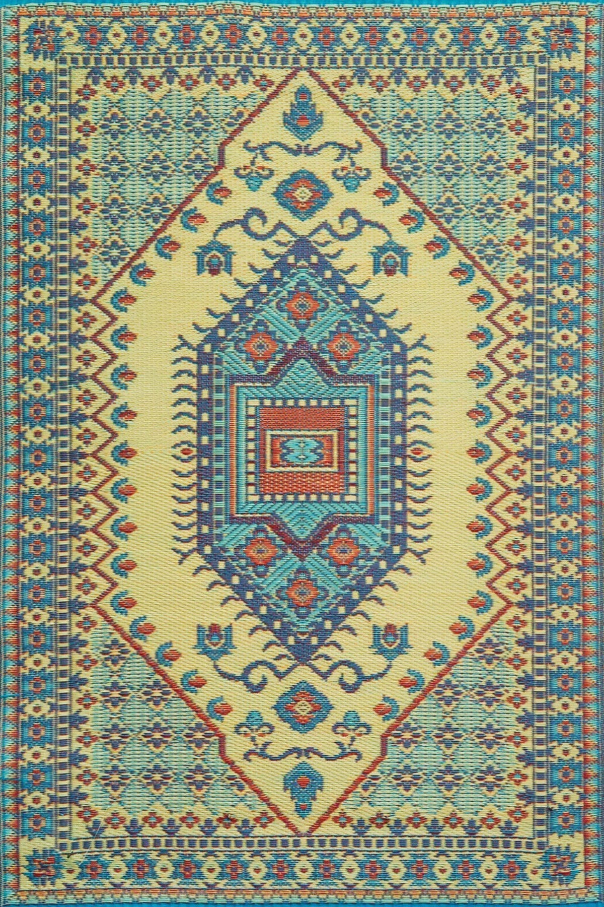 Turkish-style area rug with blue, teal, and multicolor geometric pattern