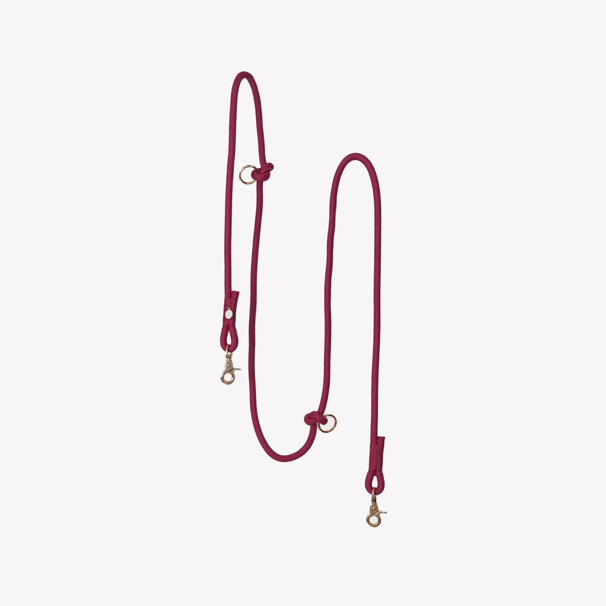 Burgundy braided dog leash with hands-free strap and metal clasps