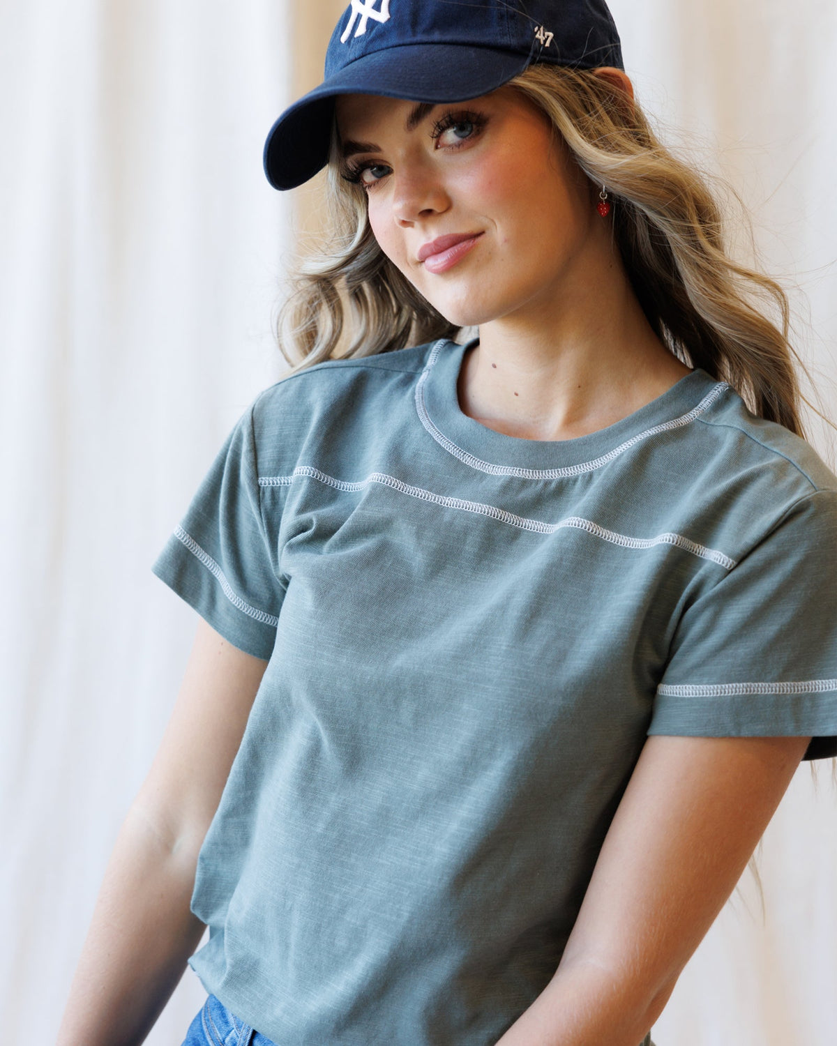 Mulled Basil crewneck T-shirt close-up, short sleeves with curved contrast trim
