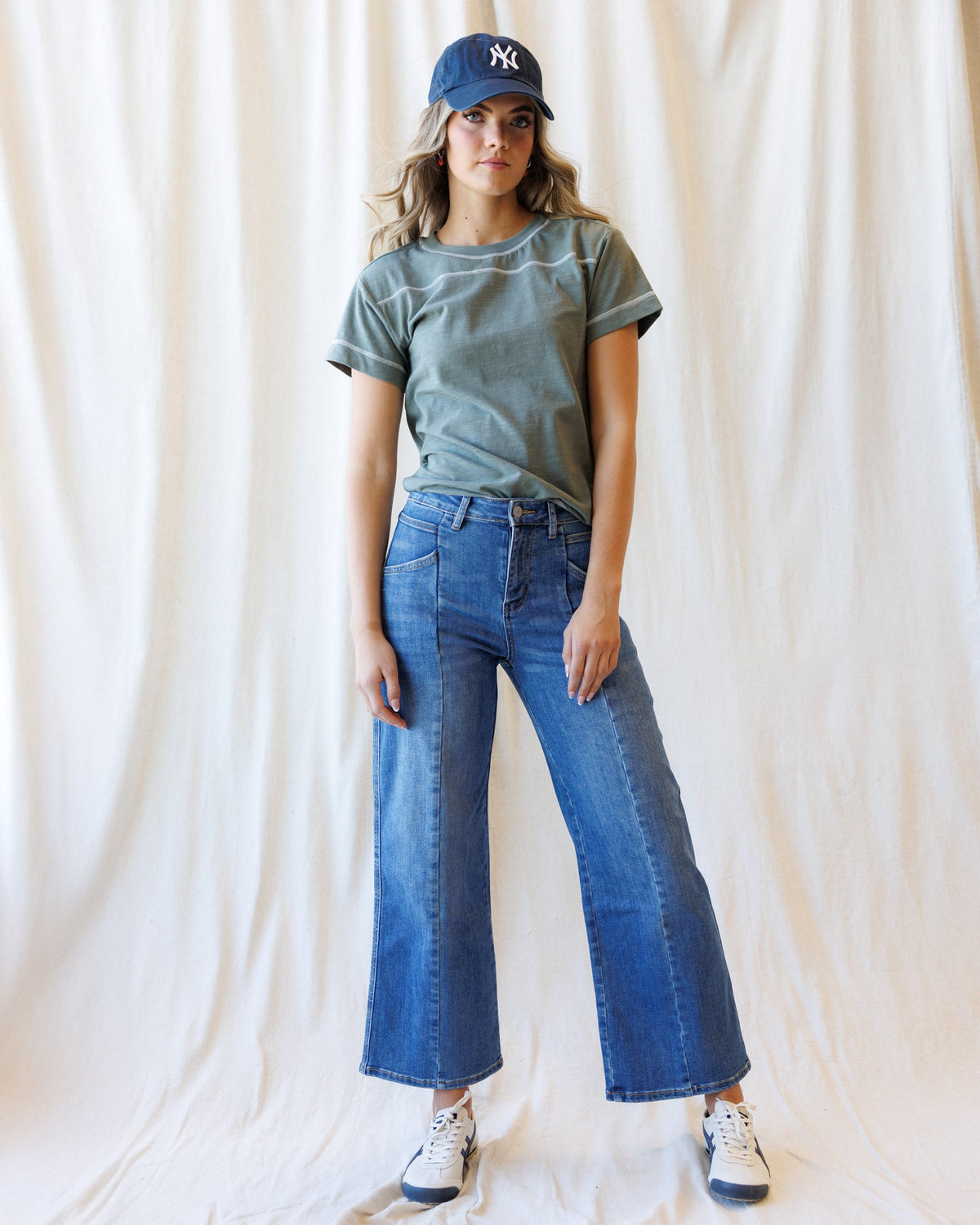 Mulled Basil crewneck T-shirt with short sleeves, worn with blue jeans