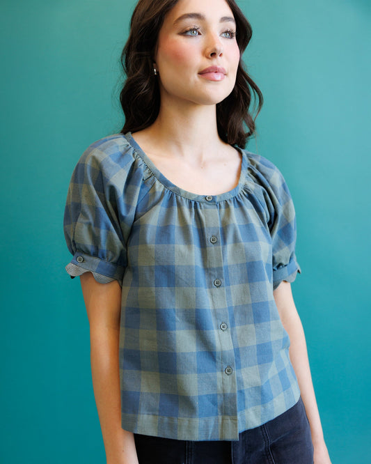 Blue checked short-sleeve blouse with gathered scoop neck and button placket