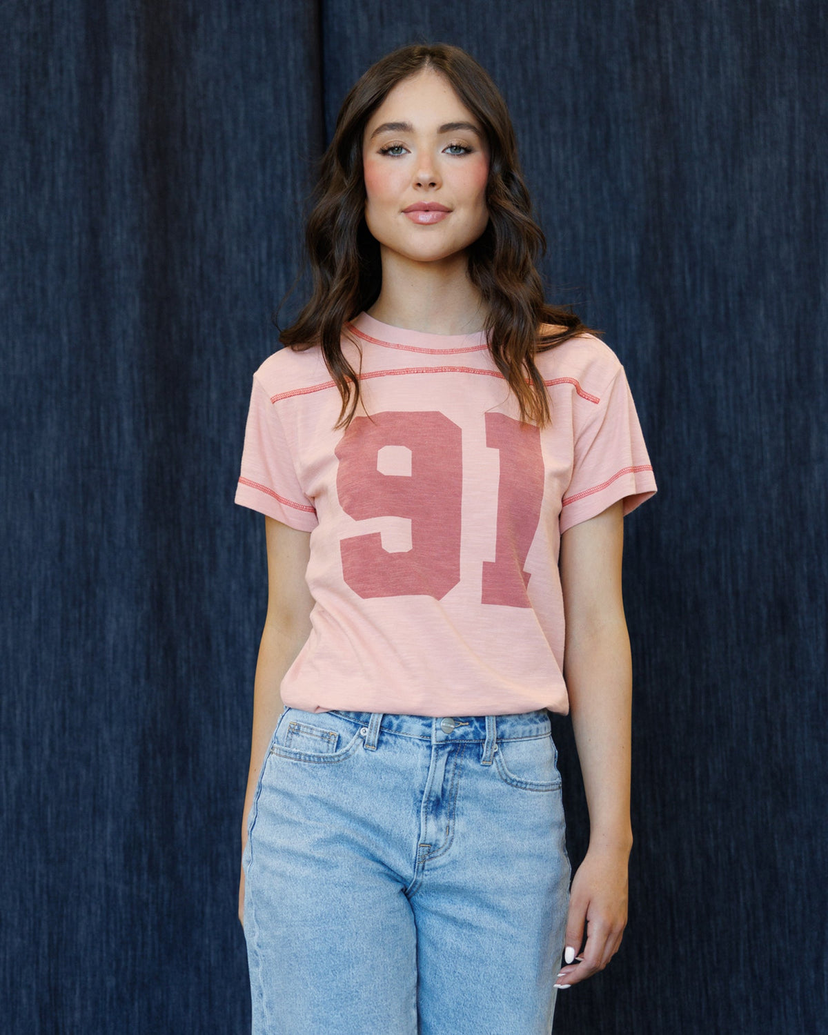 Rose tan crewneck graphic T-shirt with large 91 number print, short sleeves