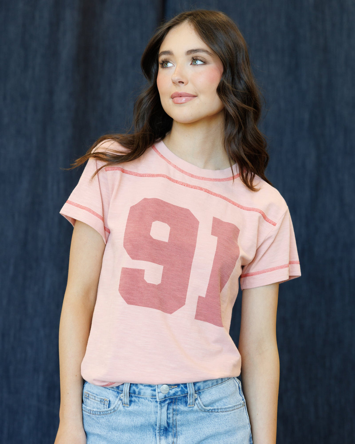 Rose tan crewneck graphic T-shirt with large 91 number print, short sleeves