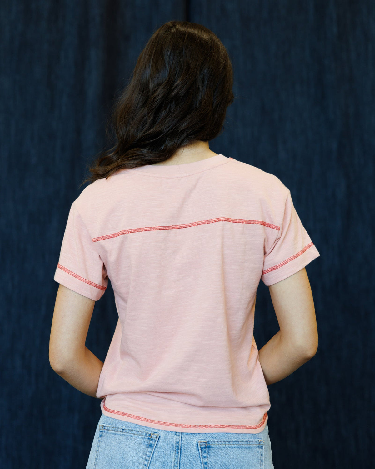 Rose tan crewneck graphic T-shirt back view with contrast trim around neckline