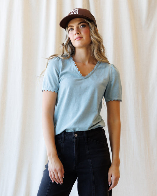 Light blue scallop-edge V-neck tee with short sleeves