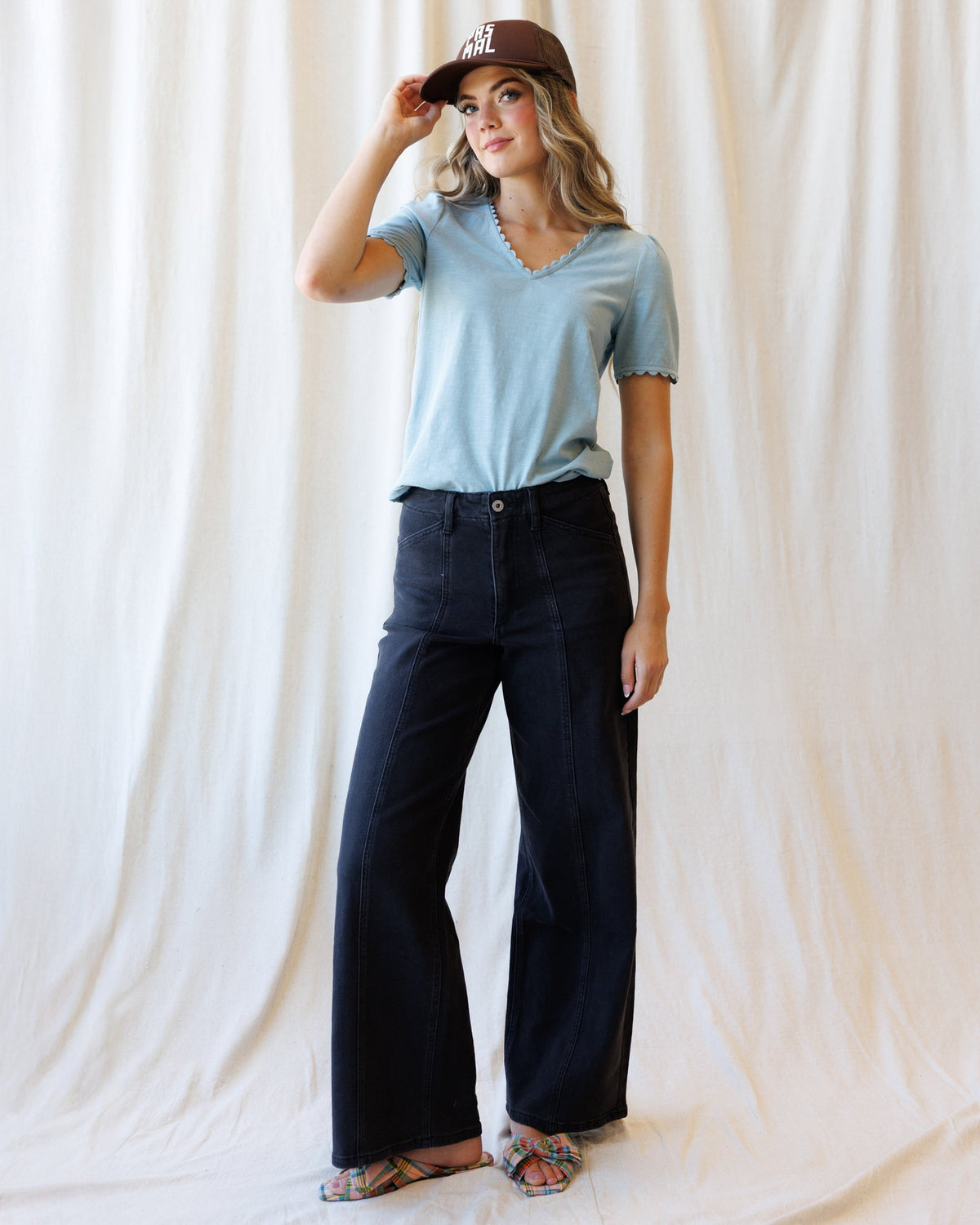 Light blue scallop-edge V-neck tee with short sleeves, full-body view