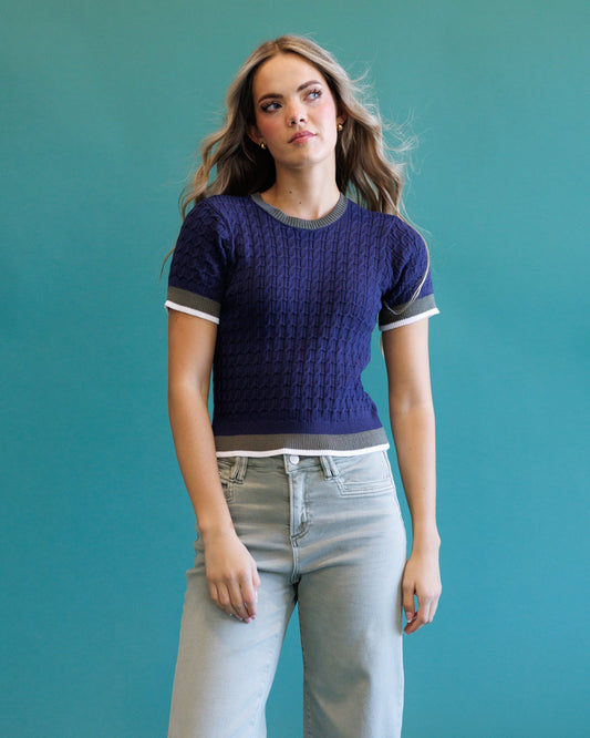 Navy cable-knit crew sweater, short sleeves, ribbed neckline with light contrast trim