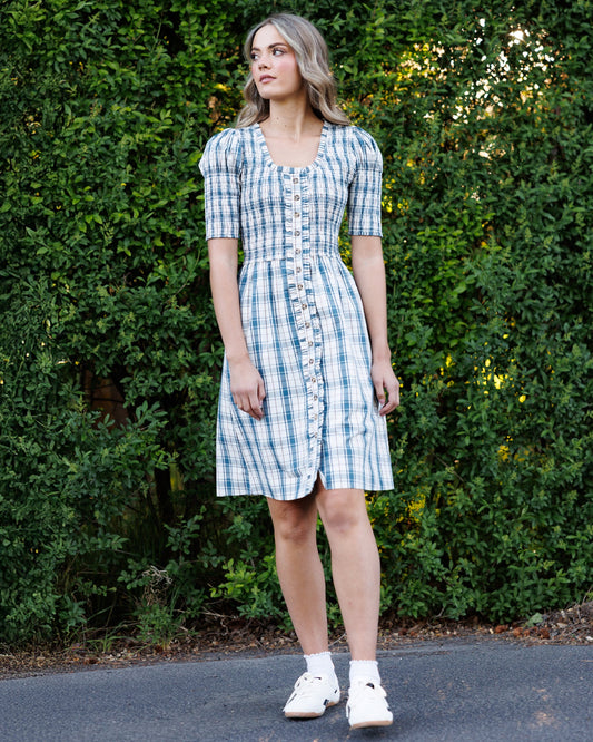 Cream and blue plaid oxford dress with square neckline, button front, puff sleeves.