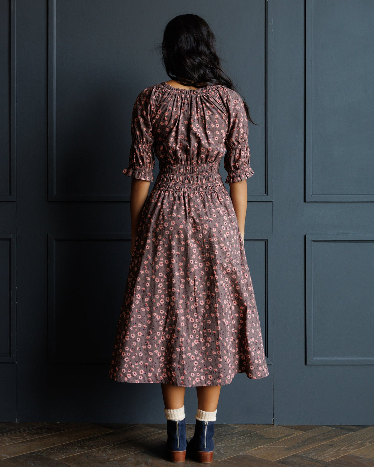 Back view dark rose floral midi dress with puff sleeves and gathered waist