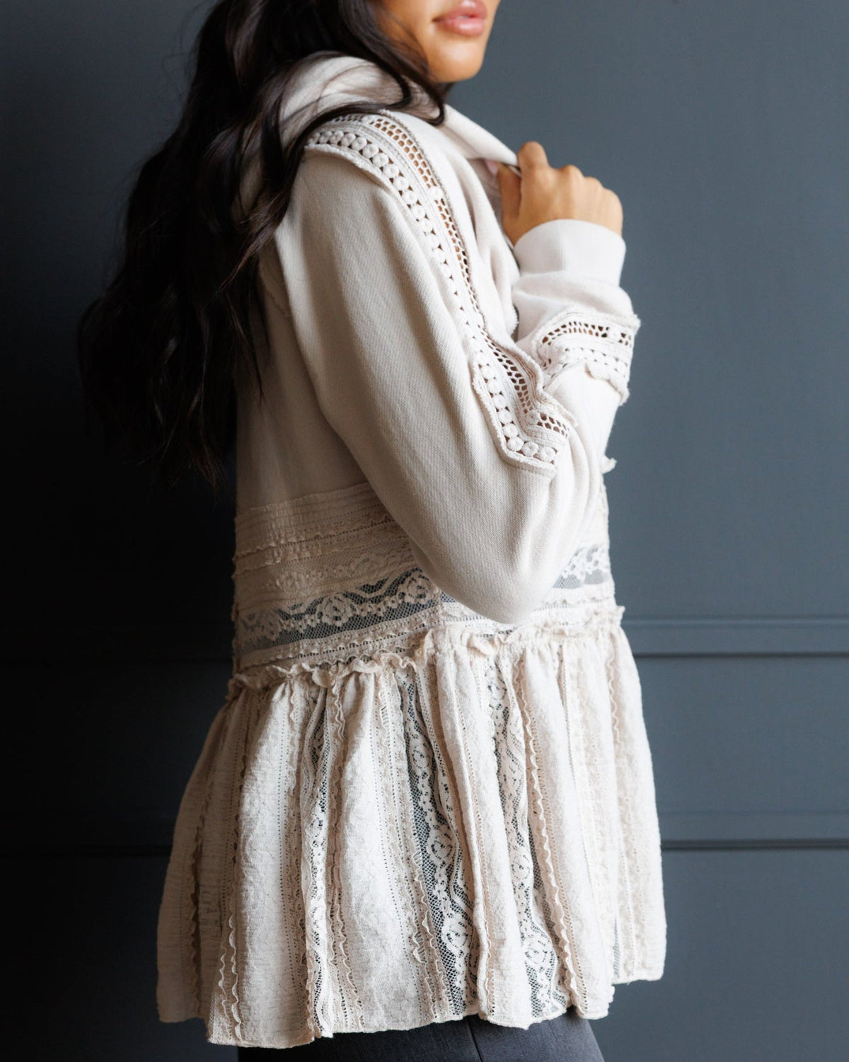 Ivory lace-trim hoodie with tiered peplum hem, side view