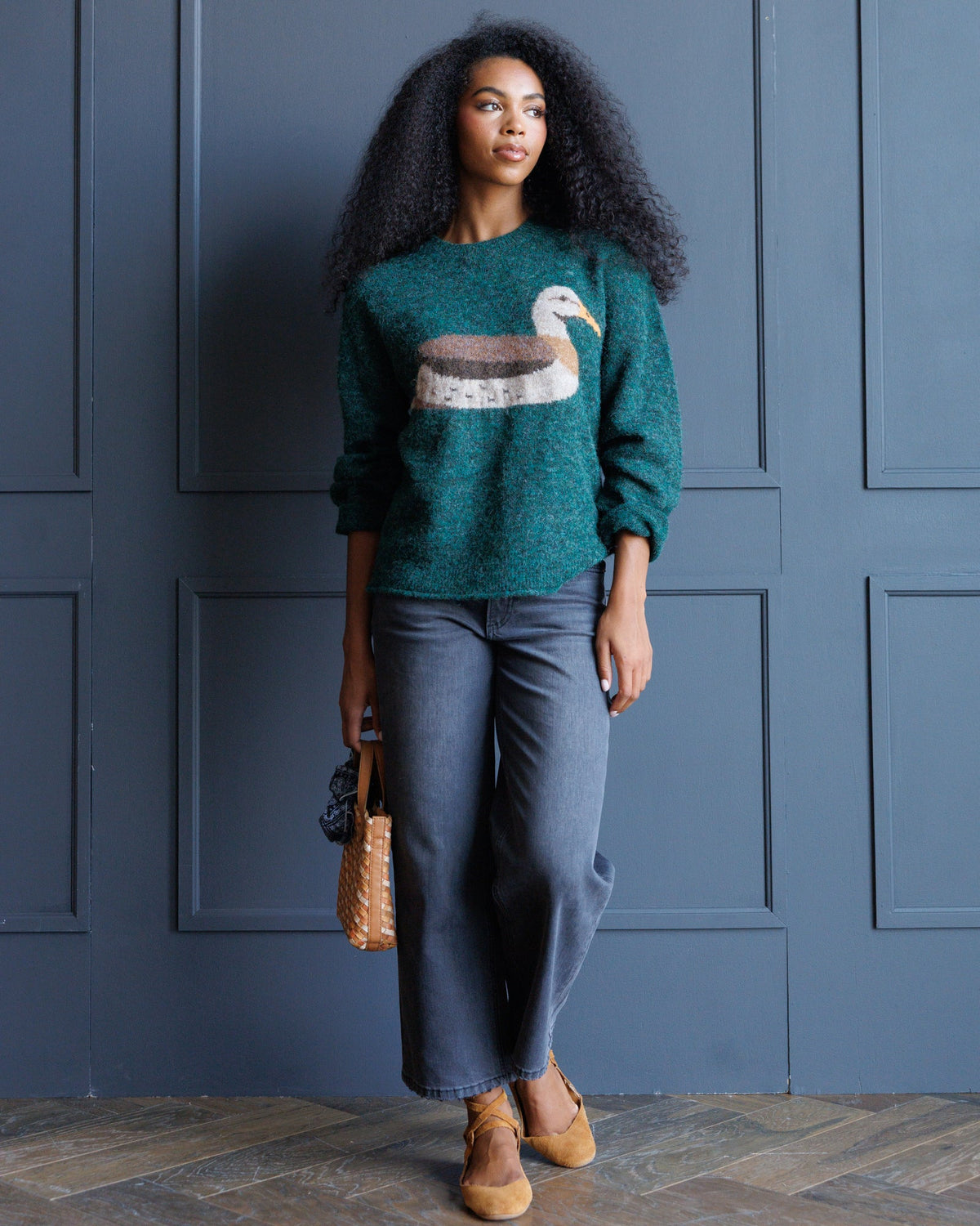 Forest green knit crewneck sweater with bird graphic, long sleeves, everyday casual style