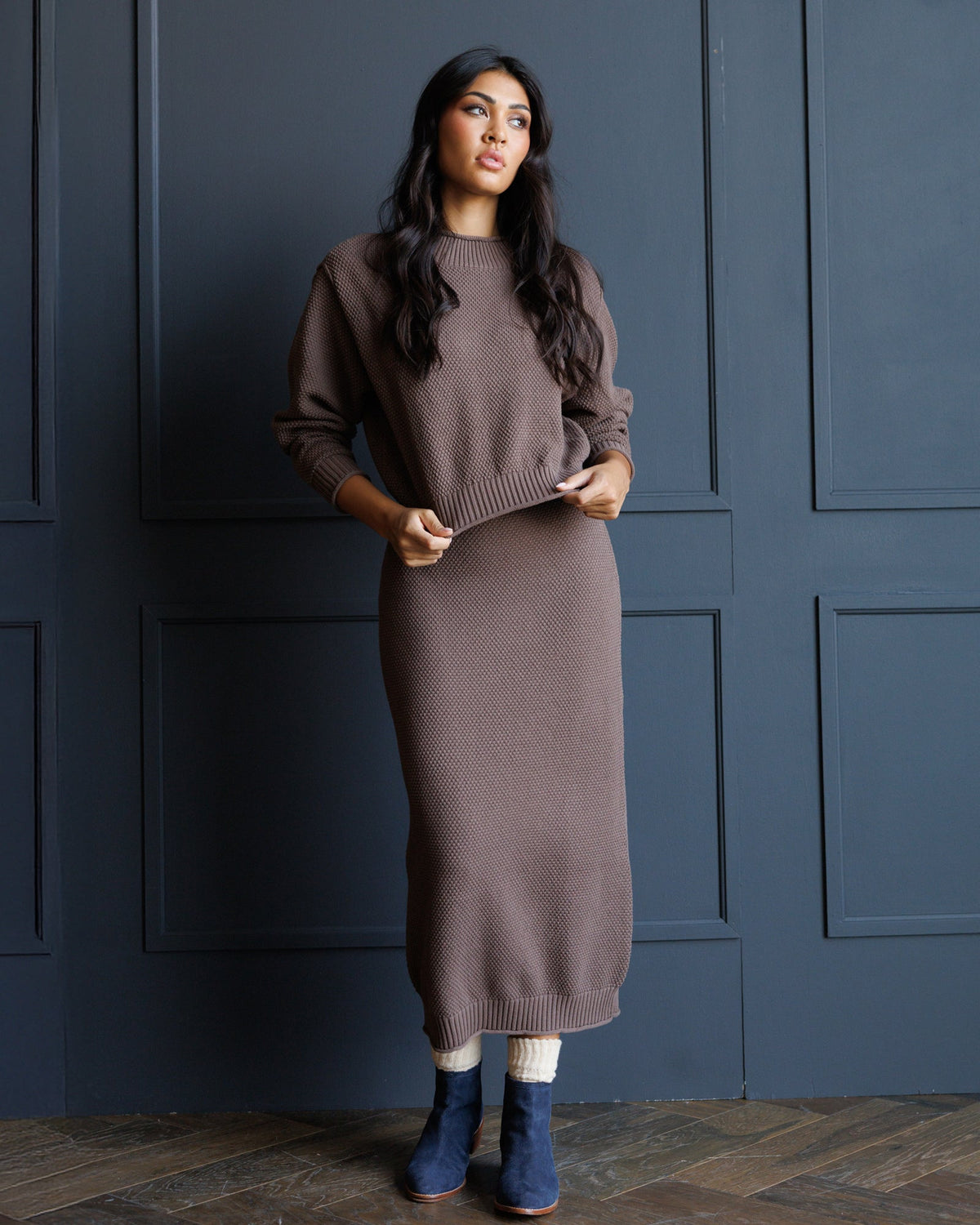 Brown knit midi skirt with ribbed waistband and hem, smooth textured knit body
