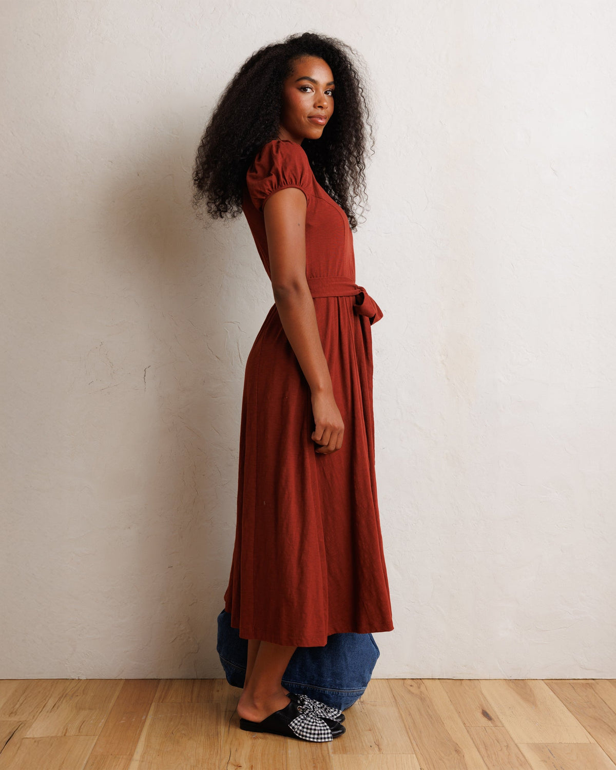 Rust short-sleeve midi dress with tied waist and soft drape skirt